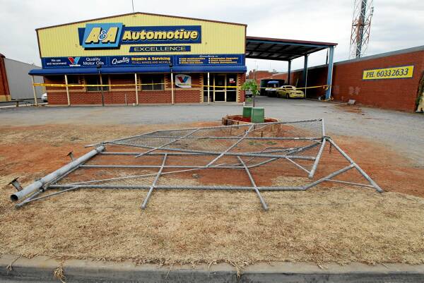 The gates at A & A Automotive, in Corowa, after the thieves left. Picture: PETER MERKESTEYN