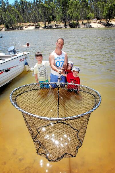 Damian Clark, of Drysdale, took Mitchell, 11, Jasper, 6, and Archer, 5, to the river to catch some fish.