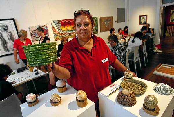 RIGHT: Sharon Edwards during a basket-weaving workshop as part of the Bundyi festival yesterday. Picture: Ben Eyles