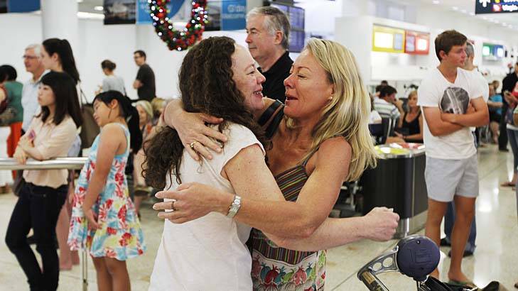 Presence wrapped with arms of love and joy … Margie Rawlinson welcomes her sister Janet Oag, who travelled from London, at Sydney Airport on Sunday.