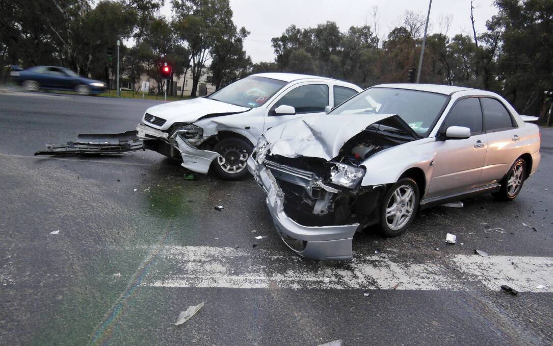 The Holden and Subaru after the crash at the Lincoln Causeway traffic lights. Picture: JAMES WAITE