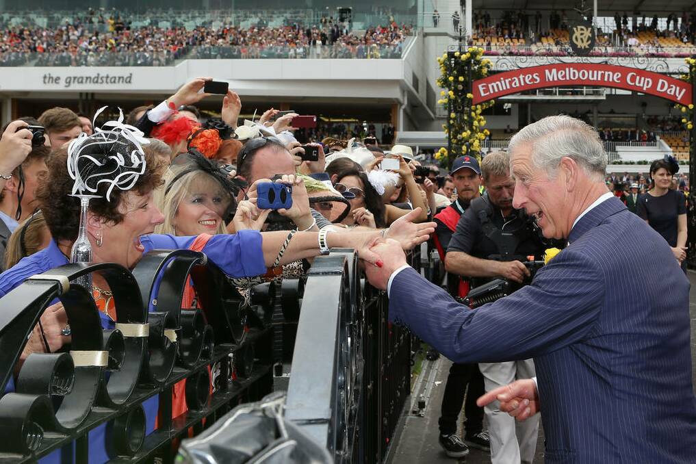 Prince Charles, Prince of Wales greets a racegoer on Melbourne Cup Day at Flemington Racecourse in Melbourne, Australia.