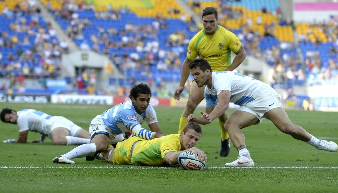  Nick Malouf of Australia scores a try during the Gold Coast Sevens round two match between Australia and Argentina. Photo: Getty Images.