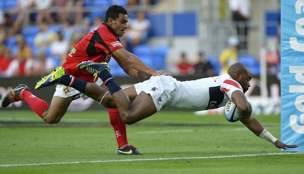 Miles Craigwell of the USA scores a try during the Gold Coast Sevens round one match between the USA and Tonga. Photo: Getty Images.