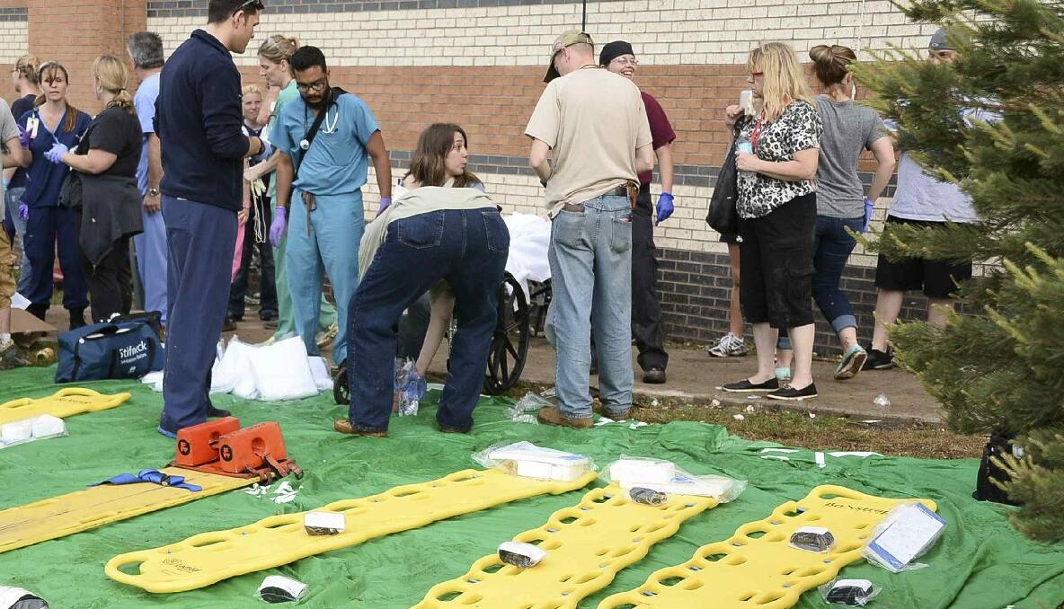 A triage area is set up next to the IMAX theatre for people injured by a tornado that struck in Moore, Oklahoma May 20, 2013. Photo: REUTERS/Gene Blevins.