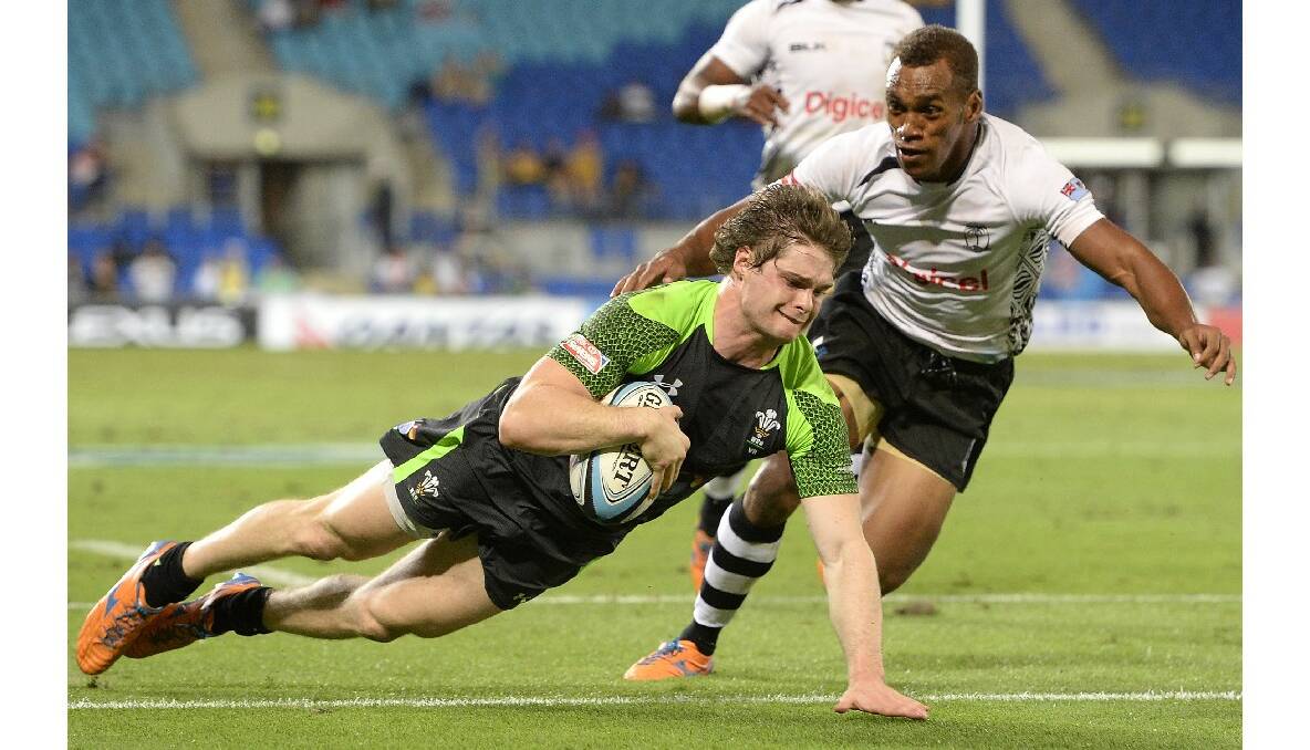 Chris Knight of Wales scores a try during the Gold Coast Sevens round one match between Wales and Fiji. Photo: Getty Images.