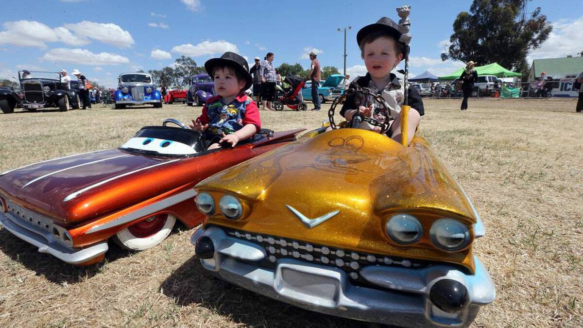 BORDER MAIL:  Lincoln Broad, 2 and his brother Camaro Board, 3, with the push carts their parents bought and altered from the US. Picture: PETER MERKESTEYN