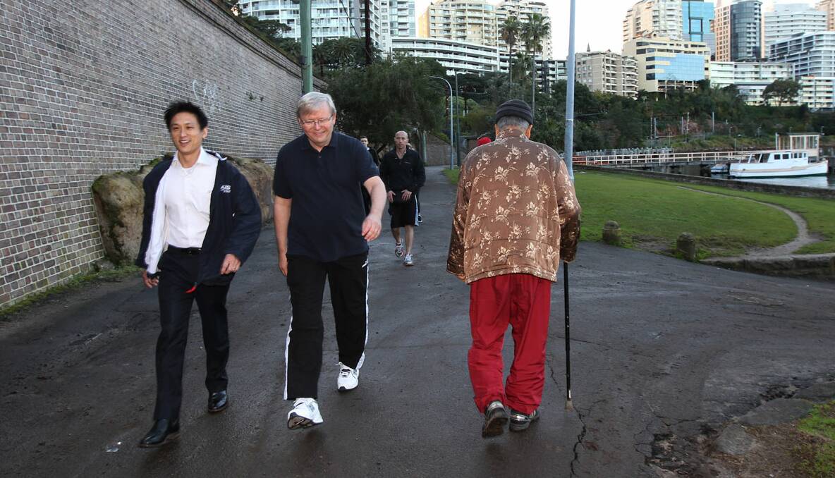 PM Kevin Rudd with Jason Li, candidate for Bennelong, walking along Sydney Harbour on Saturday morning. Photo: Jacky Ghossein 