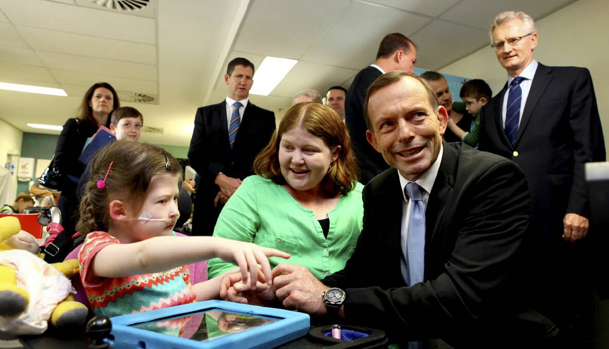 Opposition LeaderTony Abbott talks to Maya Thurect, 8, and her mum Rabecca Thurect from Brisbane, at St Vincent's Hospital, Kangaroo Point, Brisbane. 