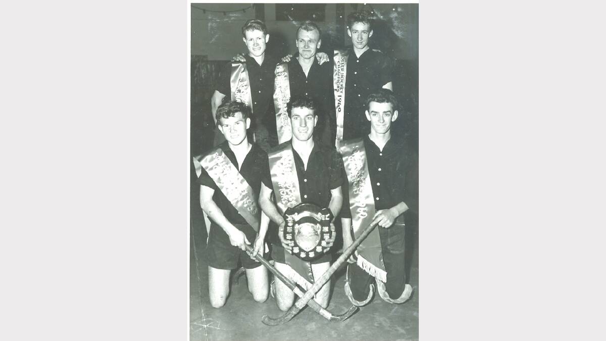 A roller hockey team won a trophy at the Palais skating rink in 1960. (Marguerite Studios)
