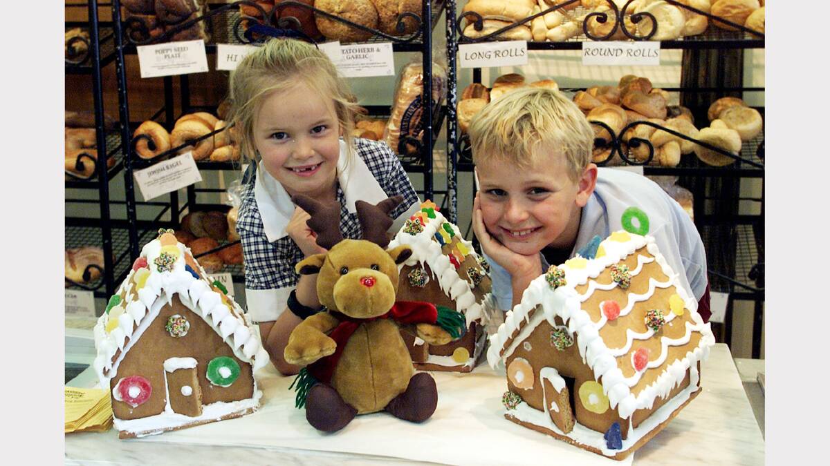 Valentines Traditional Bakehouse is baking special Christmas treats. Matilda Perry, 7, and her brother Joseph, 9, of Rutherglen, look at some of the gingerbread houses already made so far. Picture: PETER MERKESTEYN