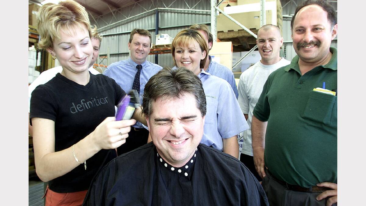 Headshave for Leukaemia foundation. Meaghan Brown from O'Brien and Co. hairdressing is shaving Rick Bowers. At the back is Brad Hodges, Paul Gaskett, Matthew Grunow, Michael Blackshaw, Natale Gigliotti with Jacki Stevens in the middle. Picture: SIMON GROVES