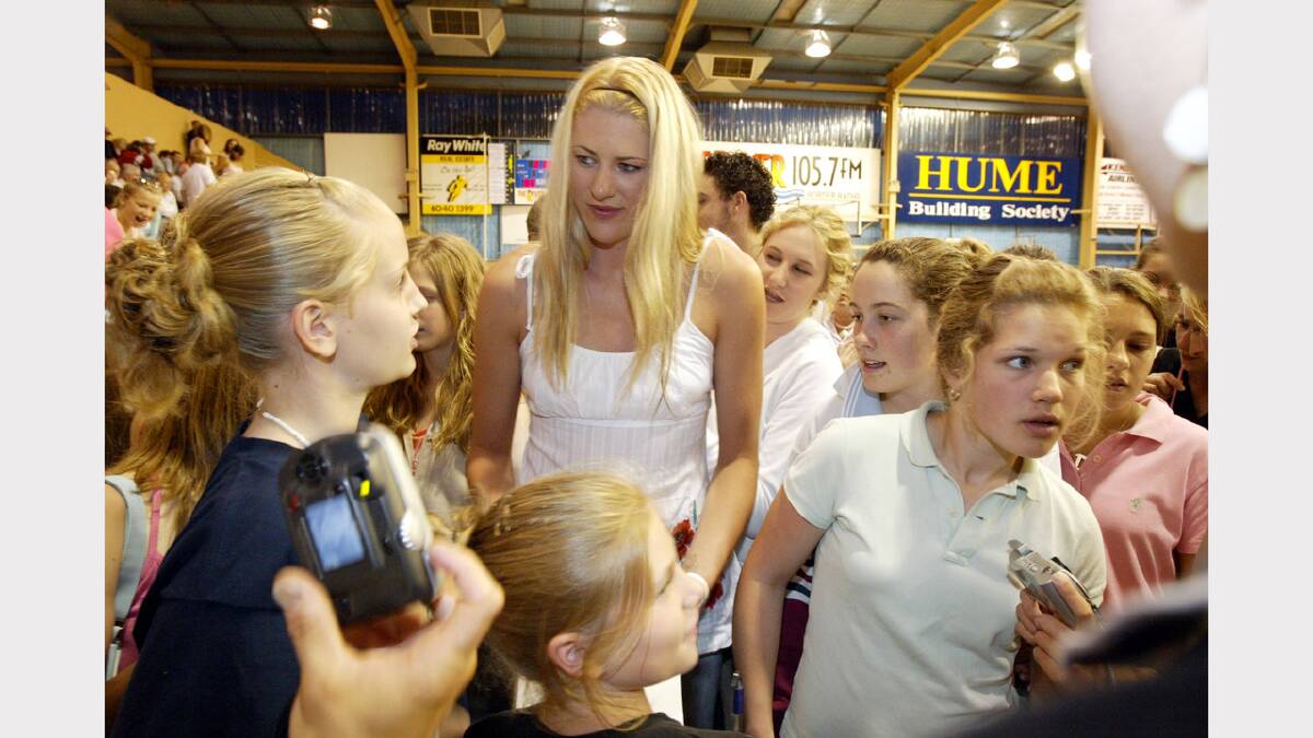 Basketball superstar Lauren Jackson is mobbed by young fans who wanted autographs at half-time of the WNBL game between Canberra and the AIS at the Albury Sports Stadium. Picture: PETER MERKESTEYN