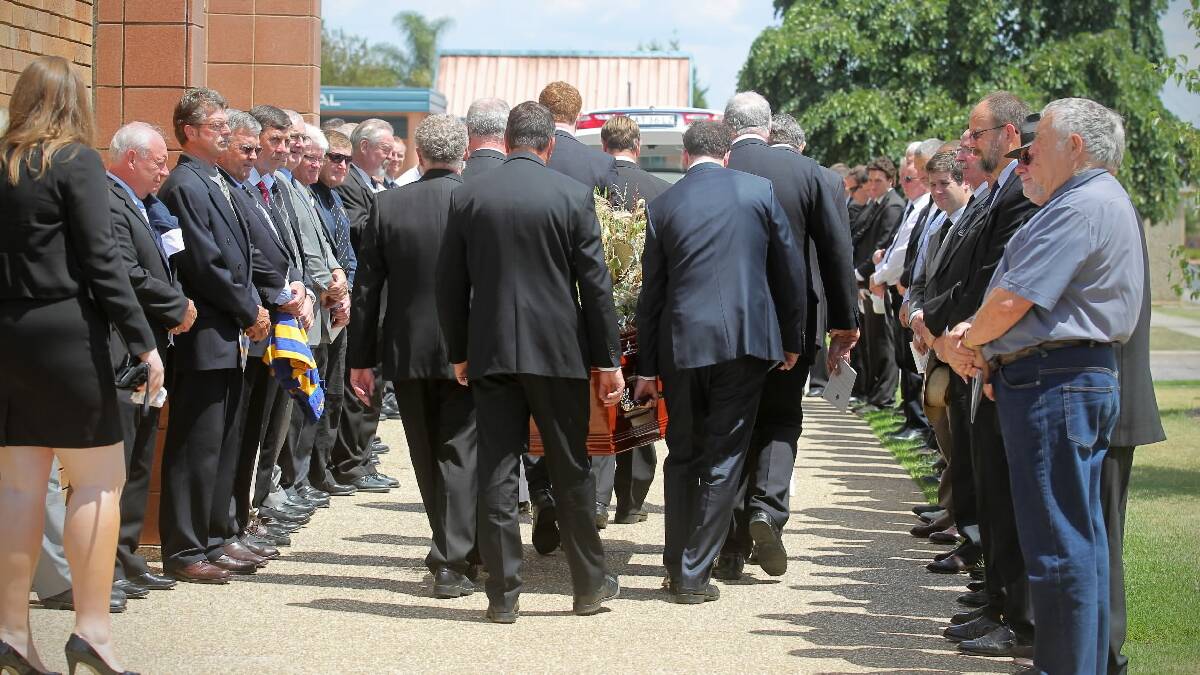 Members of the  Albury-Wodonga  Steamers form a  guard of honour at the funeral of much-loved Border agronomist John Sykes yesterday. About 400 people attended the funeral at Sacred Heart Church, North Albury. Picture: BEN EYLES