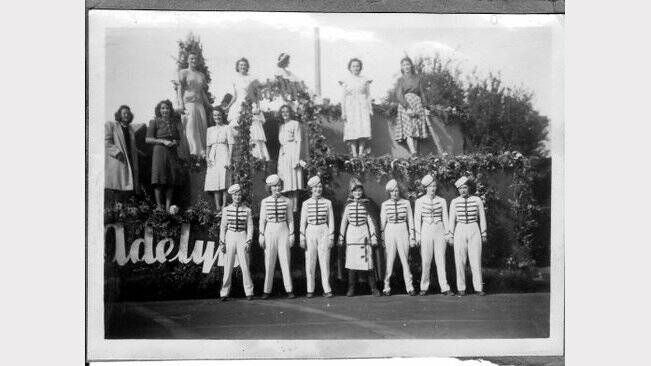 Girls from the Adelyn clothing factory in a 1950s floral festival.