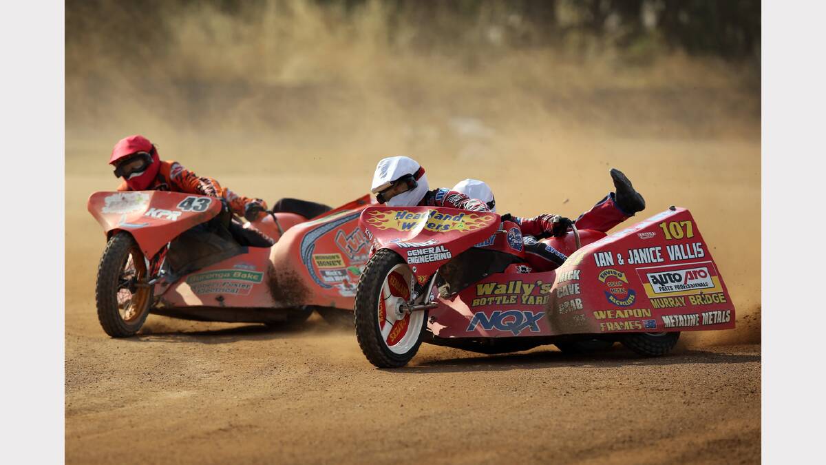 Warren Monson and Matt Morgan (red helmets) follow leaders Mick Headland and Paul Waters (white helmets) in heat 12 of the Sidecar Grand Slam Series at the Lincoln Causeway on Saturday.