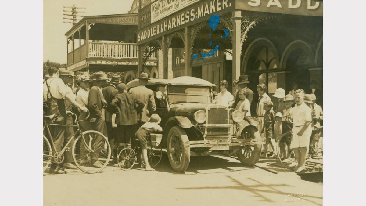 1920s photograph of Oldsmobile car surrounded by onlookers in Dean Street, Albury. Picture: ALBURYCITY COLLECTION