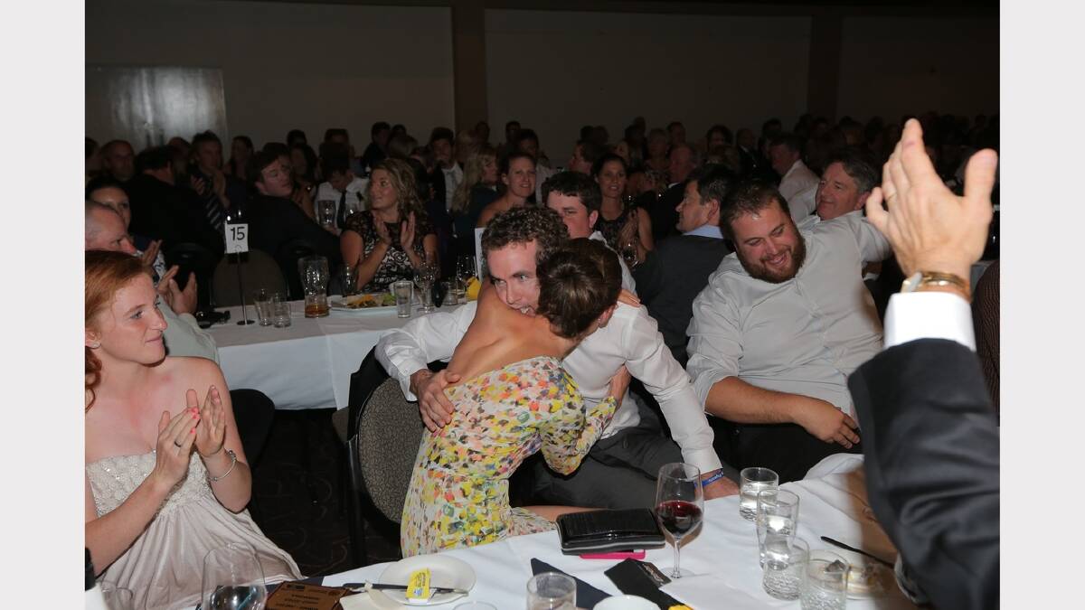 Xavier Leslie is congratulated on his Morris Medal win by wife Kylie.