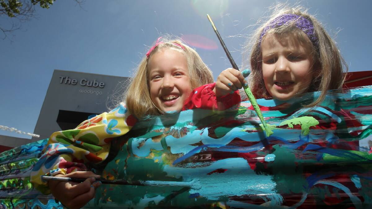 Rachel, 7, and Eleanor Crowe, 5, of Wodonga, painted mermaids as part of the Cool Relief community art project, hosted by Arts Space Wodonga, Wodonga Library and The Cube. Picture: MARK JESSER