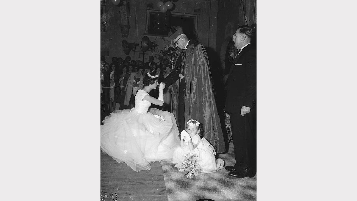Bishop Francis Henschke meets a debutante at a Catholic ball in Albury, 1950s.