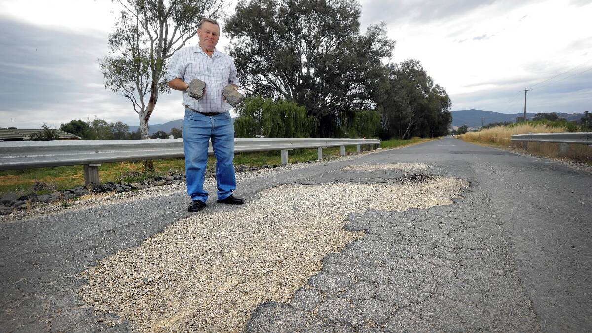 John Rooney thinks someone is going to get killed if damage like this at Boyd Road, between the Kiewa Valley Highway and Gundowring is not fixed.