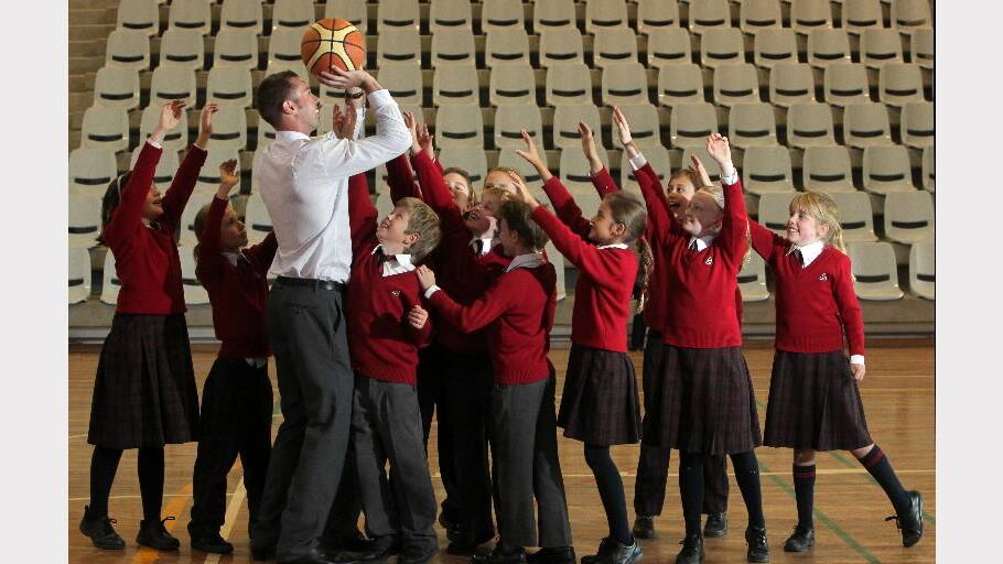 May 2011:Getting some free throw practice with his Trinity Anglican College year 4 students.
