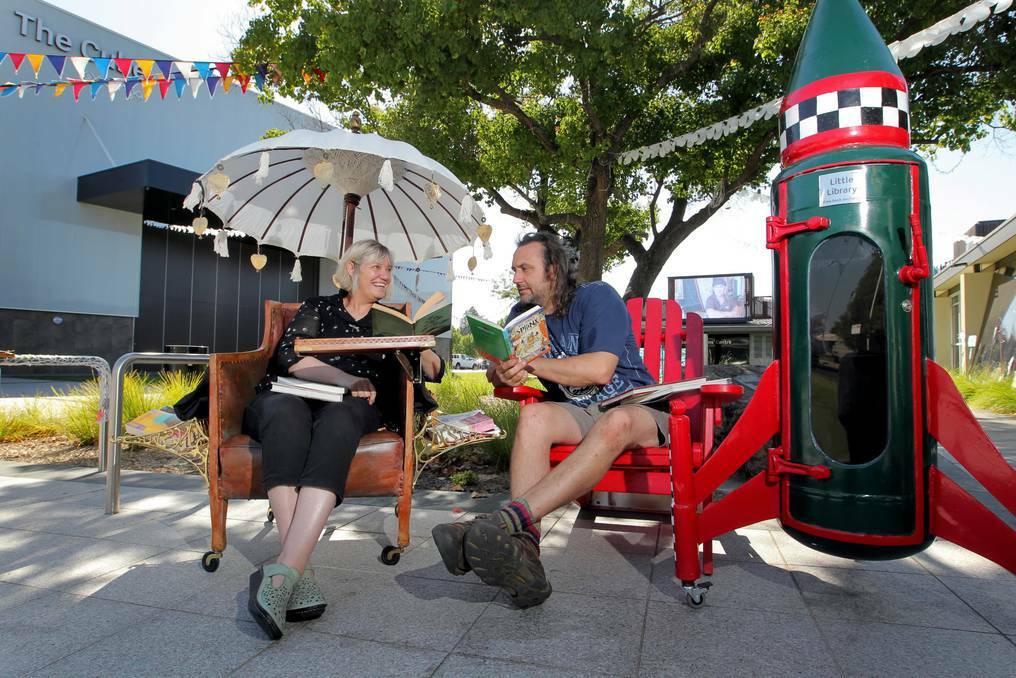 Artists Vicki Luke and Michael Laubli take their Little Free Libraries for a test drive. Picture: DAVID THORPE, The Border Mail.