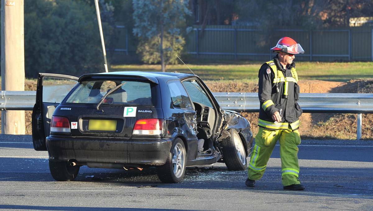 WRITTEN OFF: A woman in her 20s was trapped in this vehicle yesterday morning after colliding with a utility. Picture: Michael Frogley