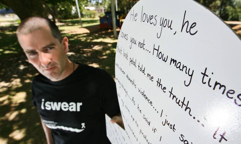 Sgt Damian Loiterton with the story of a victim of family violence, to be displayed in Wangaratta’s King George Gardens next week. Picture: BEN EYLES