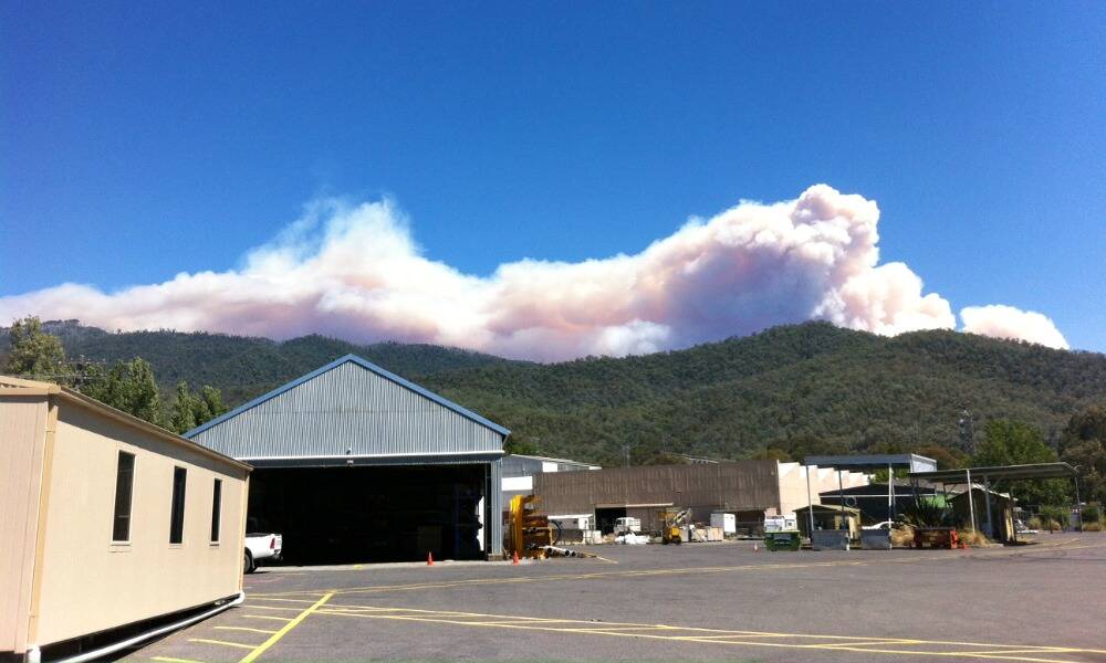 Smoke from the Smoko fire rises above Mount Feathertop. Photo taken from the AGL depot at Mount Beauty. PHOTO: Brett Esler.