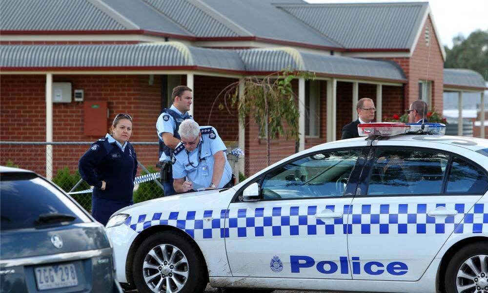 Police at the Wangaratta home yesterday where a man and a woman were found dead. PICTURE: Matthew Smithwick
