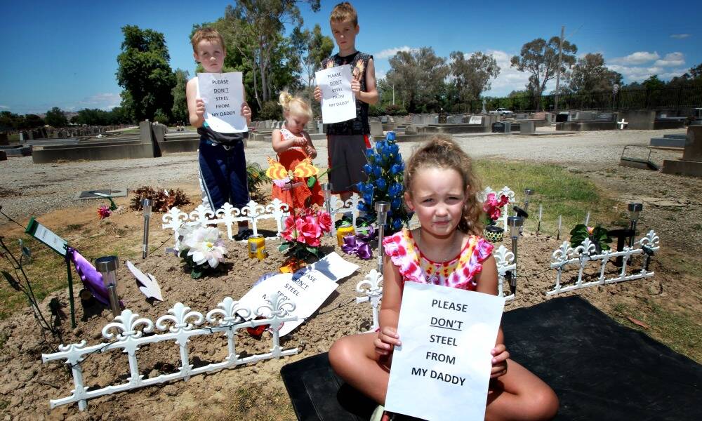 Daytona Turnbull and her siblings Jack, Shyla and Tyler have a blunt message for the person who stole lights from their father’s grave. Picture: PETER MERKESTEYN