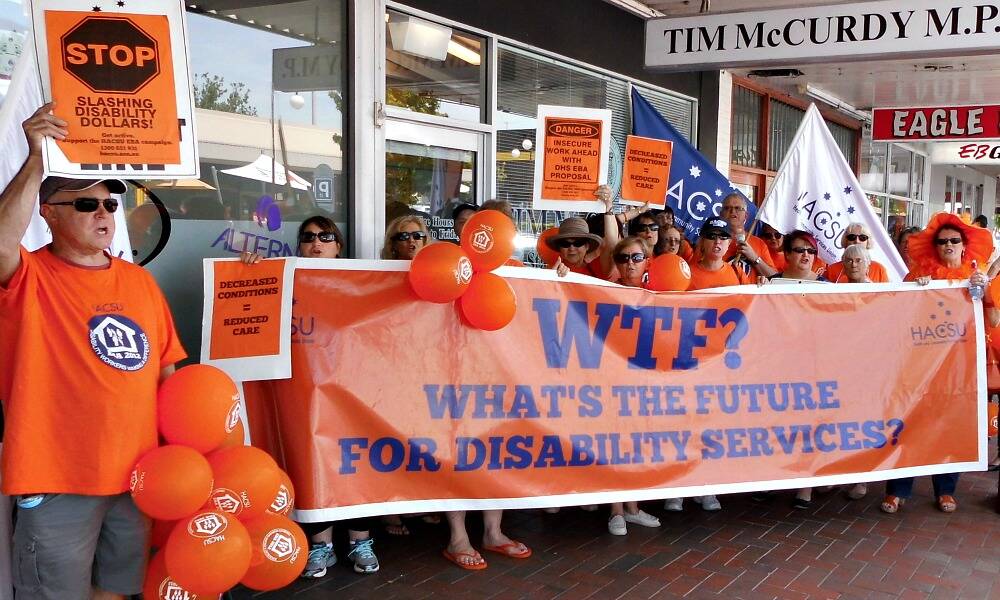 Protesters outside Tim McCurdy’s office at Wangaratta yesterday, as part of a stoppage over proposed cuts.