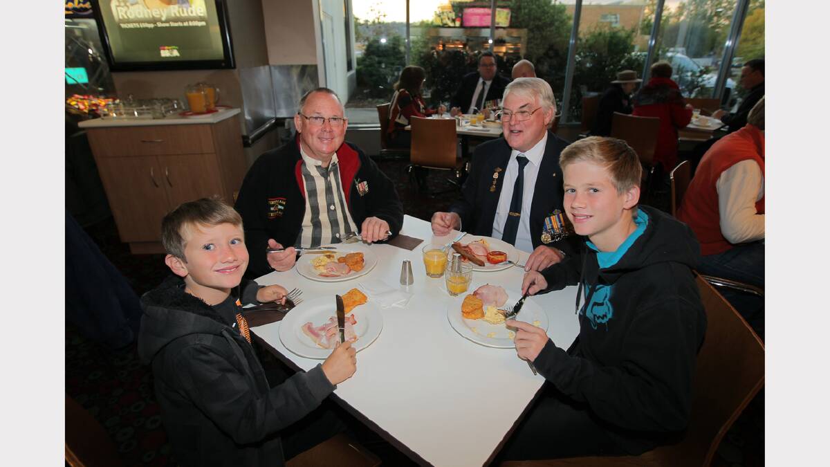 Beau Ryan, 7, of Wodonga, Bud Leask, of Perth, Eric Leask, of Wodonga, and Lachie Ryan, 12, of Wodonga. Brothers Bud and Eric both served in Vietnam from 1966-1967, and Eric brought his grandsons to the dawn service to teach them about ANZAC Day. PICTURE: Tara Gonnan.