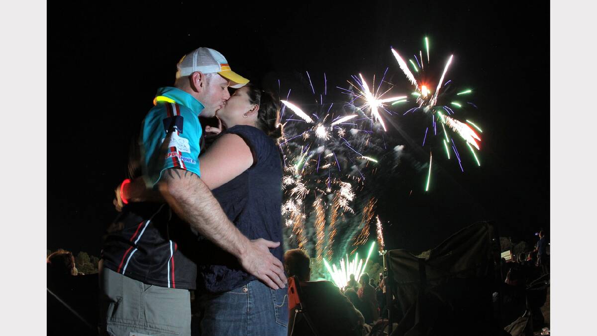 Tim Nicholls, of Thurgoona, and Debbie Redman, of Talgarno, brought in the new year a little early with a kiss at the Birallee Family Fun Night. PICTURE: Tara Goonan.