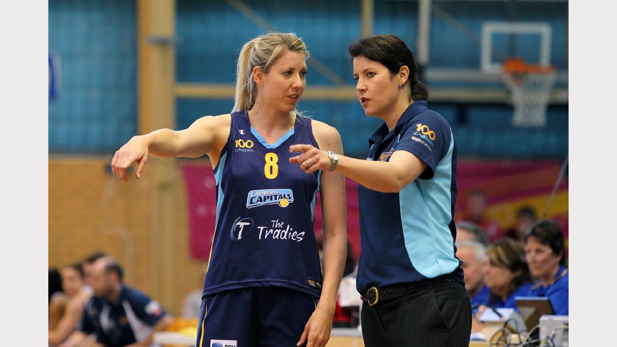 Canberra player Carly Wilson and coach Sandy Tomley speak on the sideline during the WNBL match between Canberra Capitals and Bendigo Spirit at the Lauren Jackson Sports Centre. PICTURE: Matthew Smithwick.