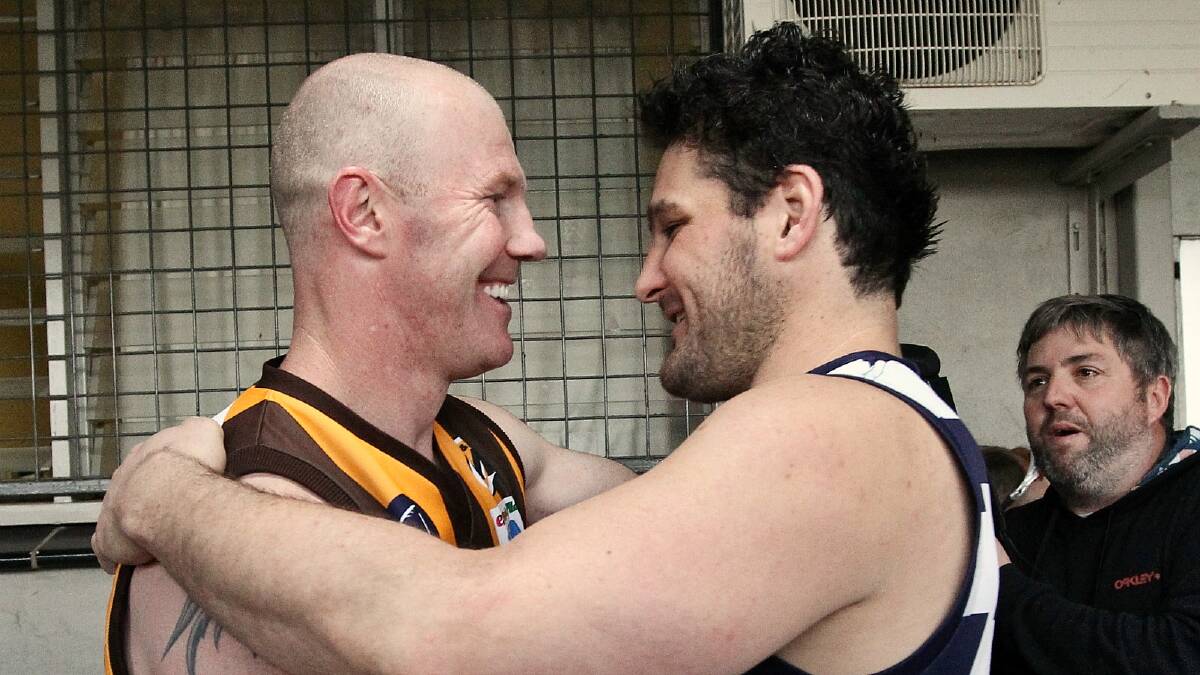 Barry Hall and Brendan Fevola embrace after yesterday's match. PICTURE: Ben Eyles.