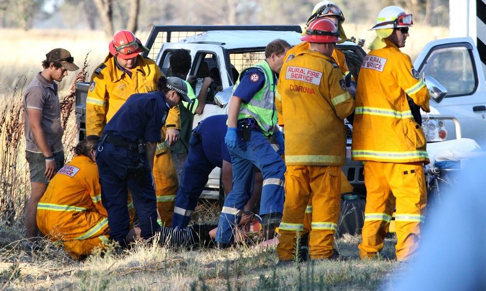 Emergency services help rescue a woman, 34, whose car crashed on the Hopefield Road at Balldale last night. Picture: BEN EYLES