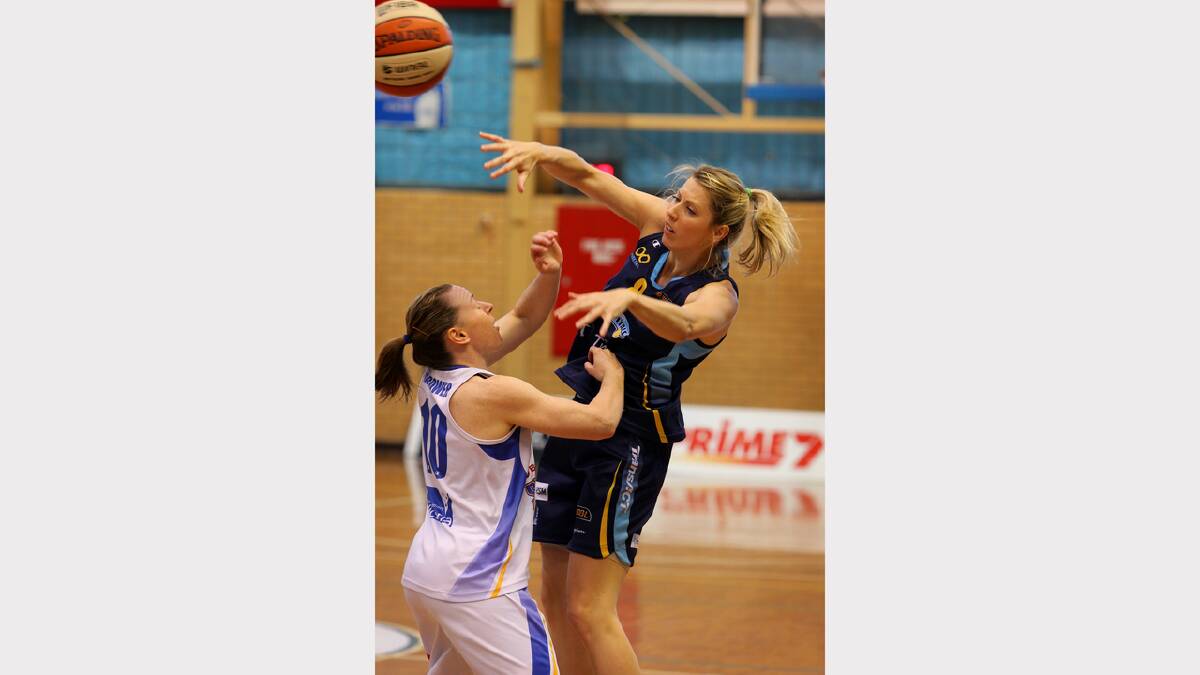 Bendigo's Kristi Harrower and Canberra's Carly Wilson in action during the WNBL match between Canberra Capitals and Bendigo Spirit at the Lauren Jackson Sports Centre. PICTURE: Matthew Smithwick.