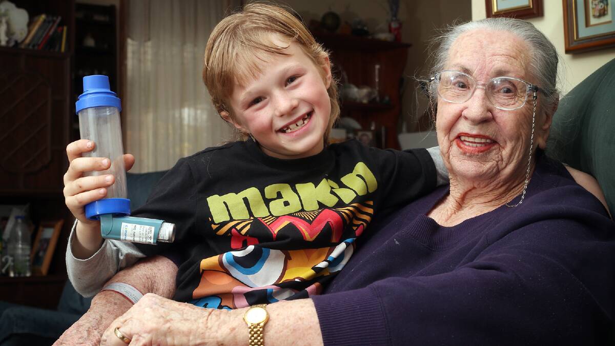 Tory Oats, 8, hugs his grandmother, Margaret Lindupp, 82, after he saved her from a severe asthma attack. Picture: JOHN RUSSELL