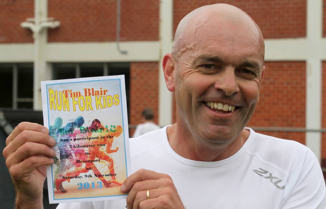 Tim Blair shows off his Run for Kids certificate after Saturday's run.