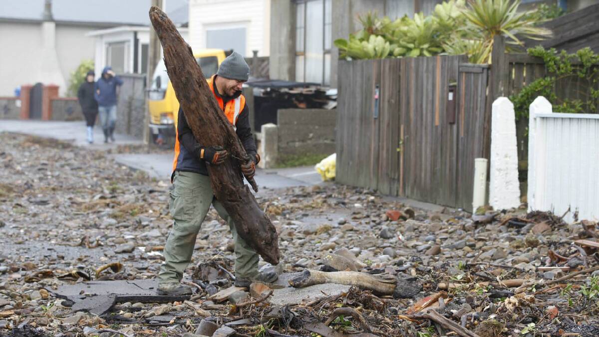 Residents begin to clean-up in Wellington. Picture: PHIL REID