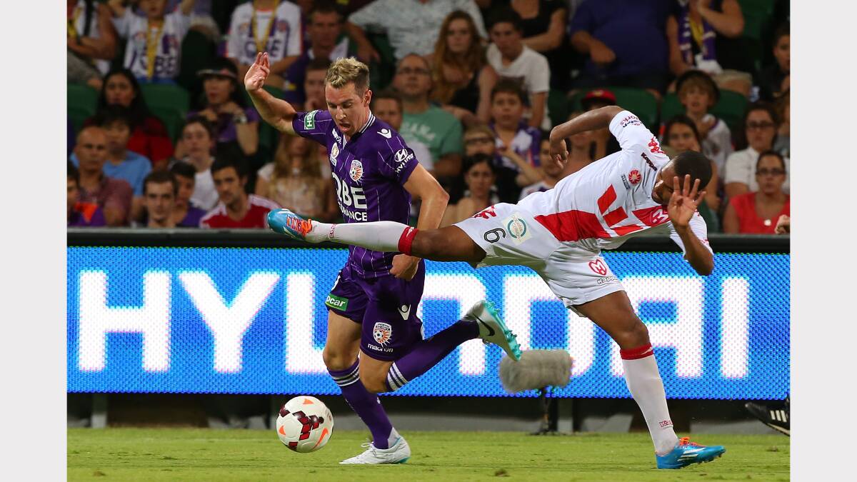 Glory's Shane Smeltz wins a contest for the ball against Heart's Patrick Gerhardt at a match last month. Picture: GETTY IMAGES