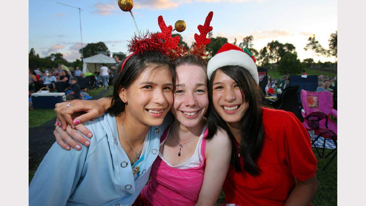 Wodonga Carols By Candlelight. Margaret Pridmore, Melissa Lawrence and Jane Pridmore, all 15. Picture: MATTHEW SMITHWICK
