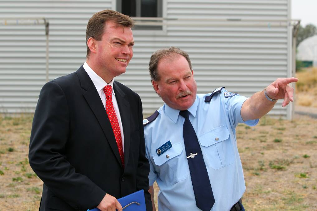 Hume prisons region general manager Terry Jose gives Minister for Corrections and Prime Prevention Edward O'Donohue a tour of the construction site. 