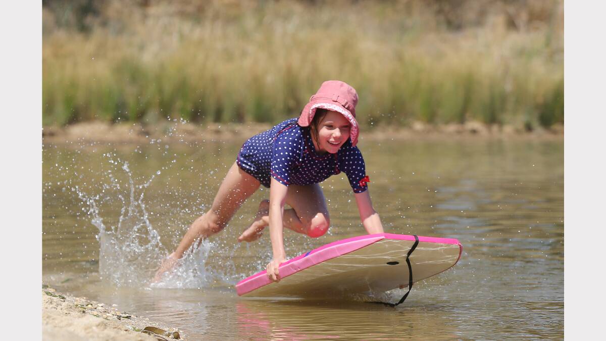 Annabele Martinae, 10, launches into the waters of Lake Sampbell, in Beechworth. 