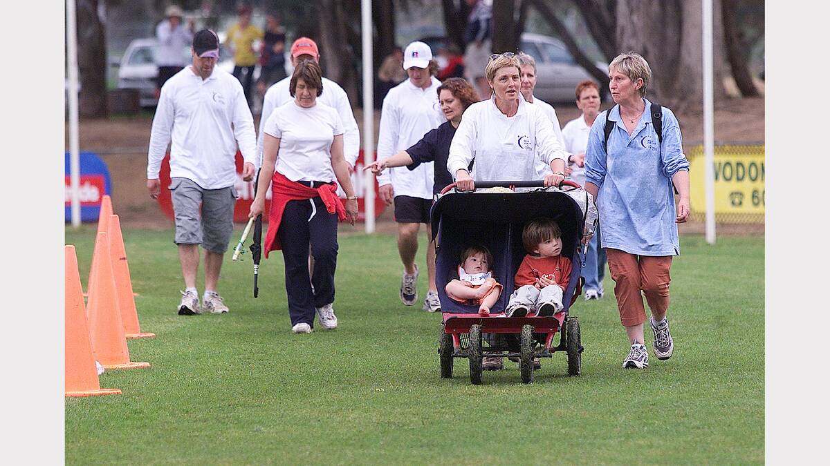 2003 - Marian Steele and Di Wells push children Filippo Martonooti, 1, and Umberto Martonooti, 3, around the field. 