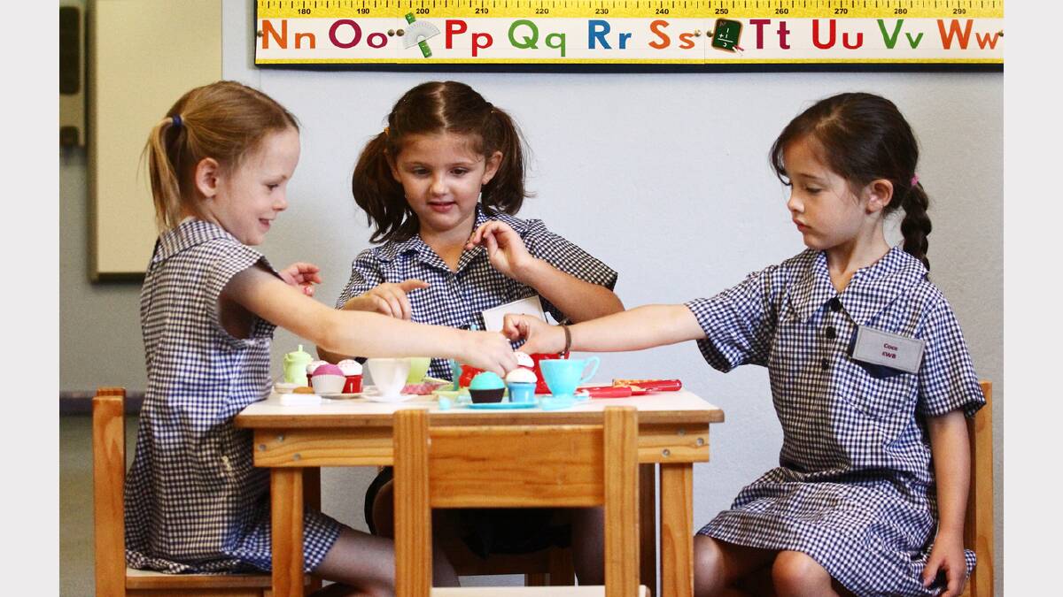 Charlotte Rodd, Elliana Briggs and Coco Azzi play with a tea set during their first day at Albury Primary School. Picture: BEN EYLES