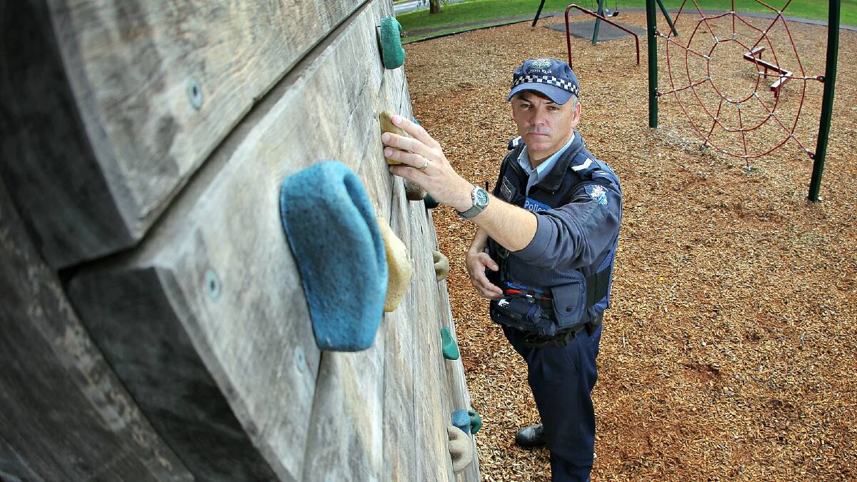 Sen-Constable Brad Beecroft is disgusted that someone hid blades in the hand holds of the rock climbing wall at Cundy Park. Picture: TARA GOONAN
