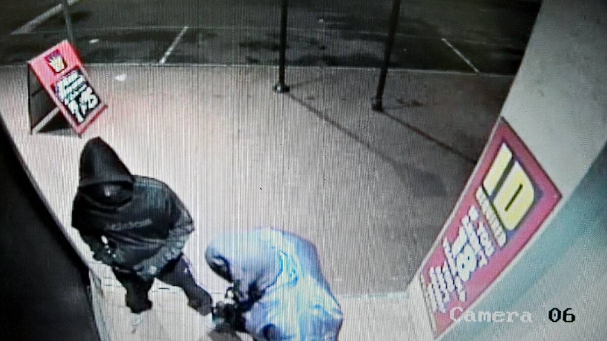 CCTV footage shows Harry Millington, left, and Ian Schaeffer, right, as they discover the door to the Premix King is locked.